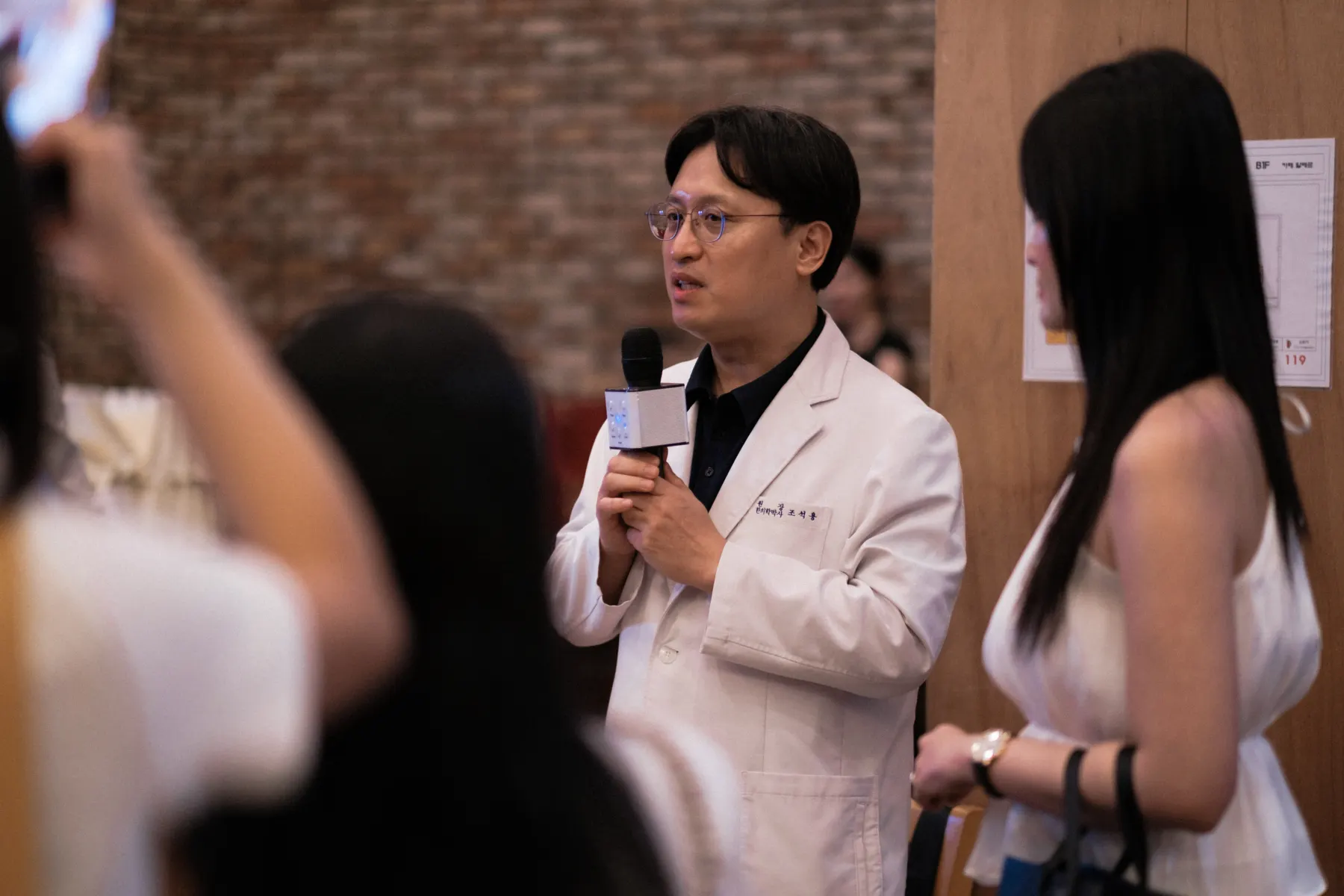 Dr. Jo Seok-yong presenting Baegayul in a white coat